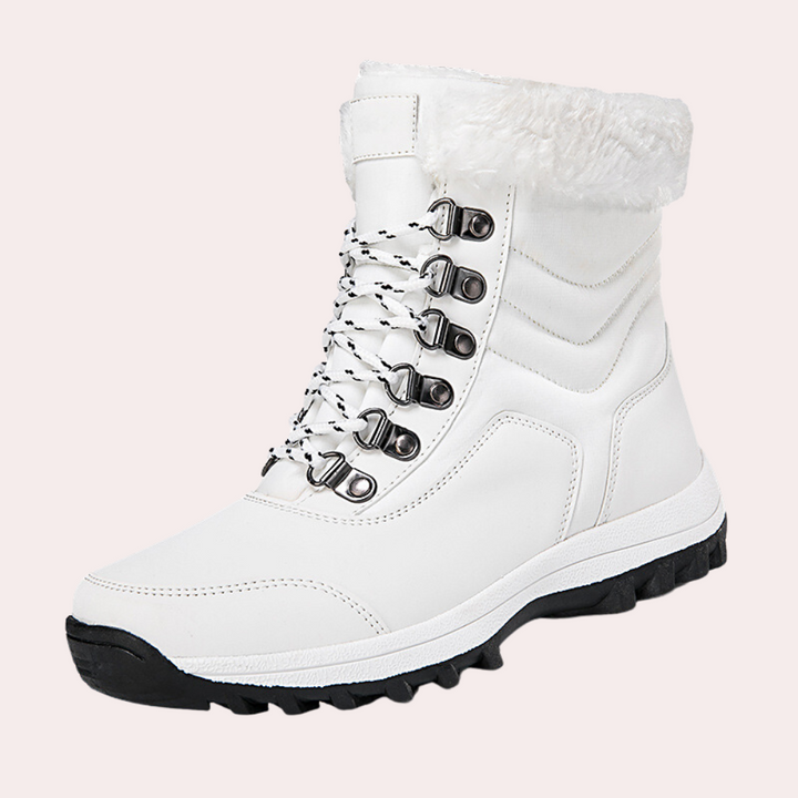 Witte winterlaars met bontkraag, stevige zool en vetersluiting. Ideaal voor dames, warme en modieuze sneeuwlaarzen. Perfect voor koude seizoenen.