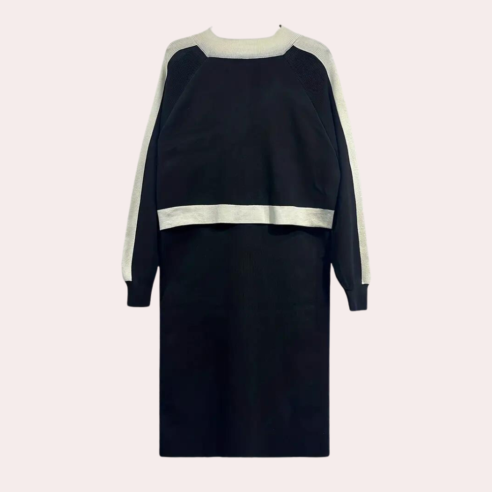 Zwarte damesjurk met lange mouwen en witte accenten, elegante casual mode, geschikt voor herfst en winter, comfortabele pasvorm.