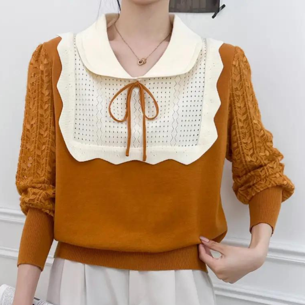 Vrouw draagt oranje trui met witte kraag en kanten details, modieuze herfstkleding, stijlvolle damesmode, casual outfit, trendy design.