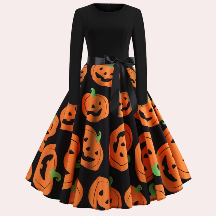Zwart-oranje Halloween jurk met pompoenprint, lange mouwen en strik. Perfect voor feestelijke herfstkleding en Halloween-thema outfits.
