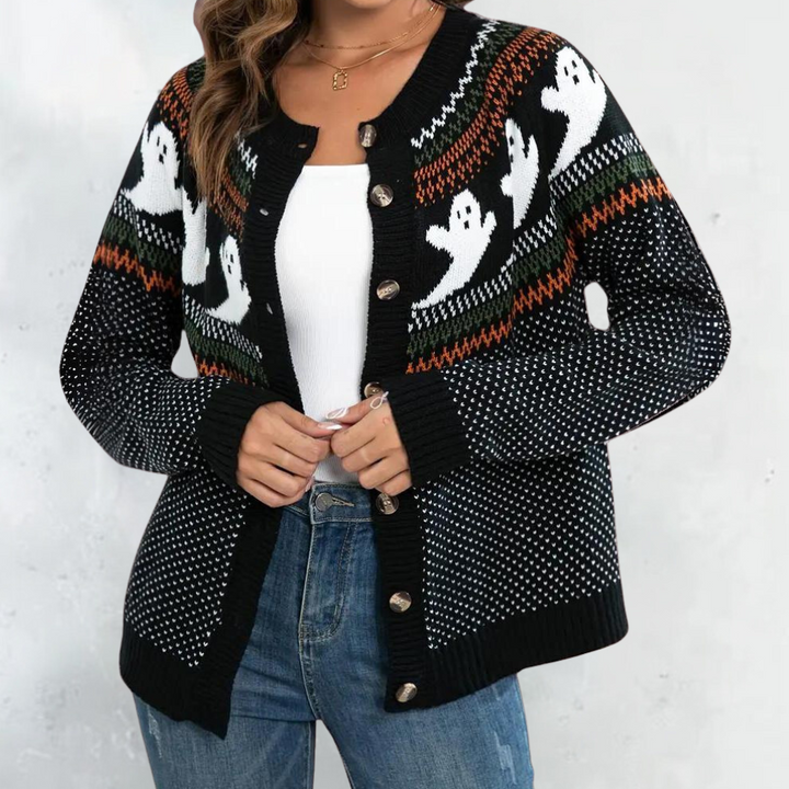Zwarte Halloween-trui met spookmotief, knopen en kleurrijke accenten. Perfect voor herfstmode en feestelijke gelegenheden. Comfortabel en stijlvol.