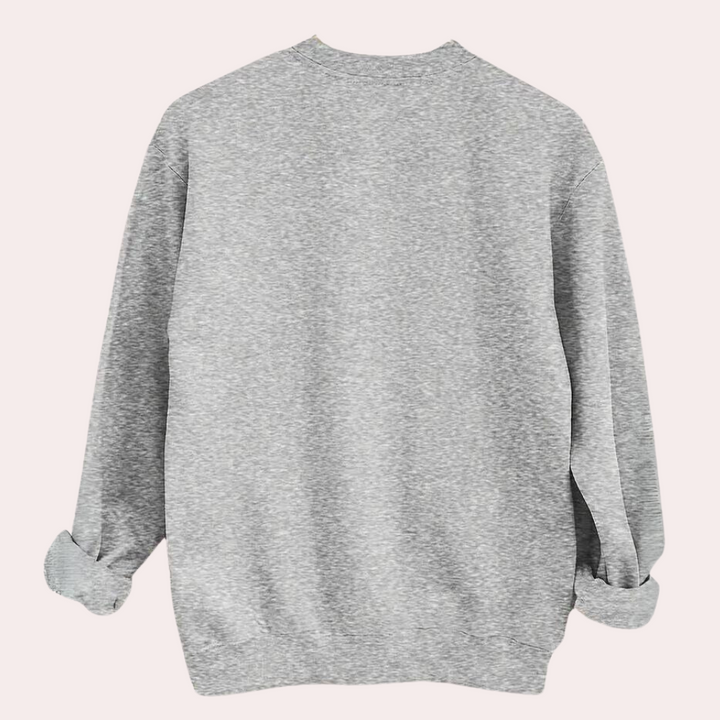 Grijze oversized sweater, achterkant, uniseks, casual stijl, comfortabele pasvorm, gerolde mouwen, modieuze kleding, herfst-winter mode.