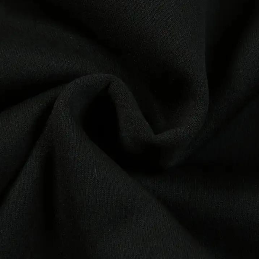 Zwarte katoenen stof close-up, zachte textuur, geschikt voor kleding en interieur. Hoogwaardige kwaliteit, duurzaam en ademend materiaal.