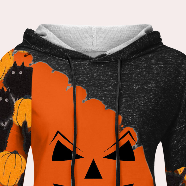 Oranje en zwarte Halloween hoodie met pompoen en zwarte kat print, capuchon en trekkoorden. Perfect voor herfst en Halloween festiviteiten.