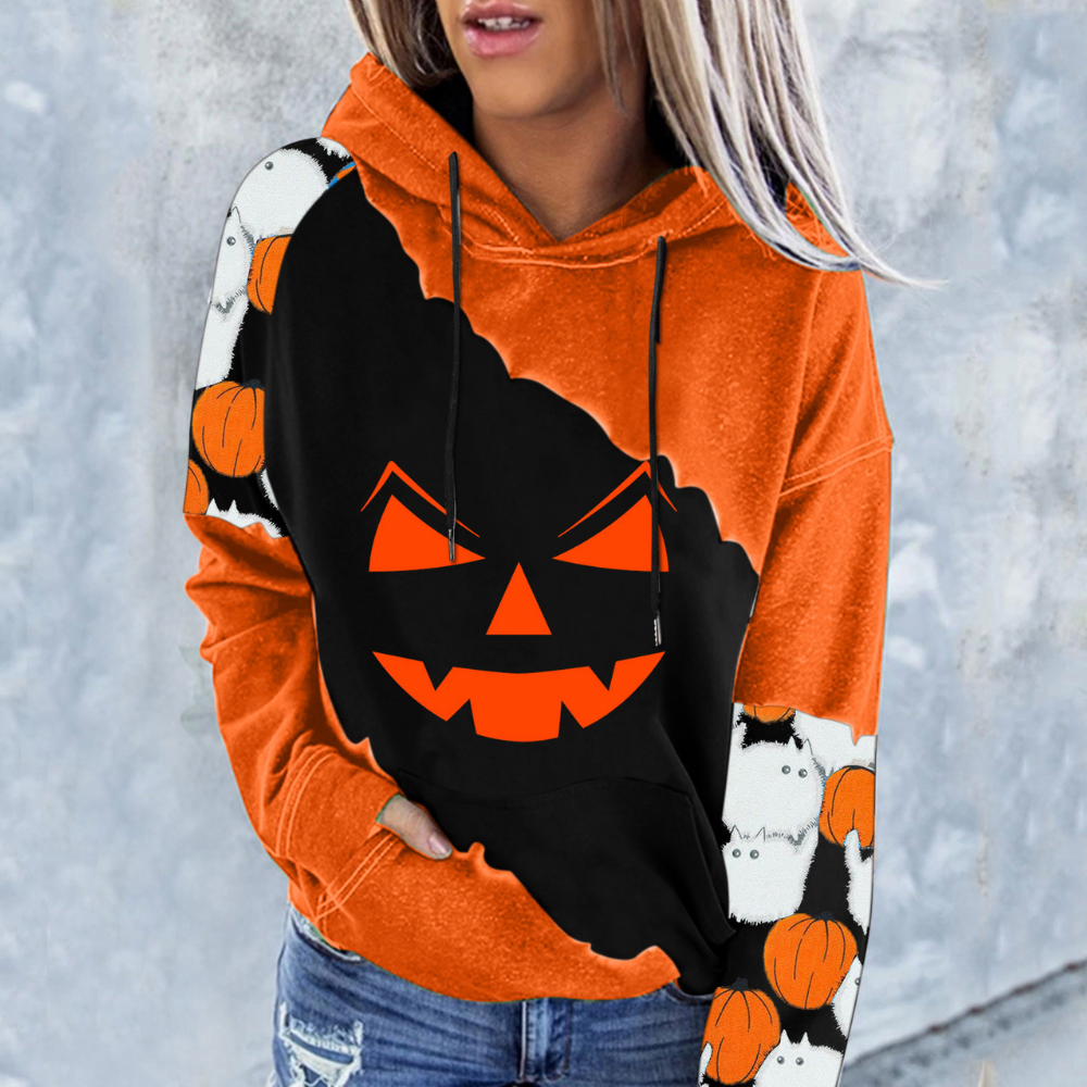 Oranje Halloween hoodie met zwarte pompoenprint en griezelige gezichten, ideaal voor herfstmode. Comfortabele pasvorm, perfect voor Halloween-feestjes.