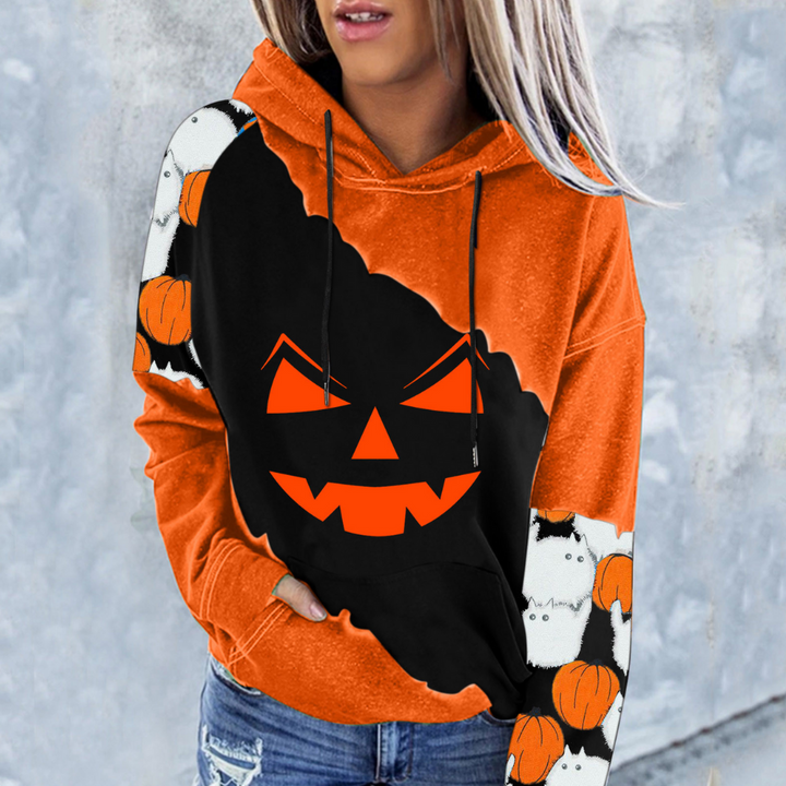 Oranje Halloween hoodie met zwarte pompoenprint en griezelige gezichten, ideaal voor herfstmode. Comfortabele pasvorm, perfect voor Halloween-feestjes.