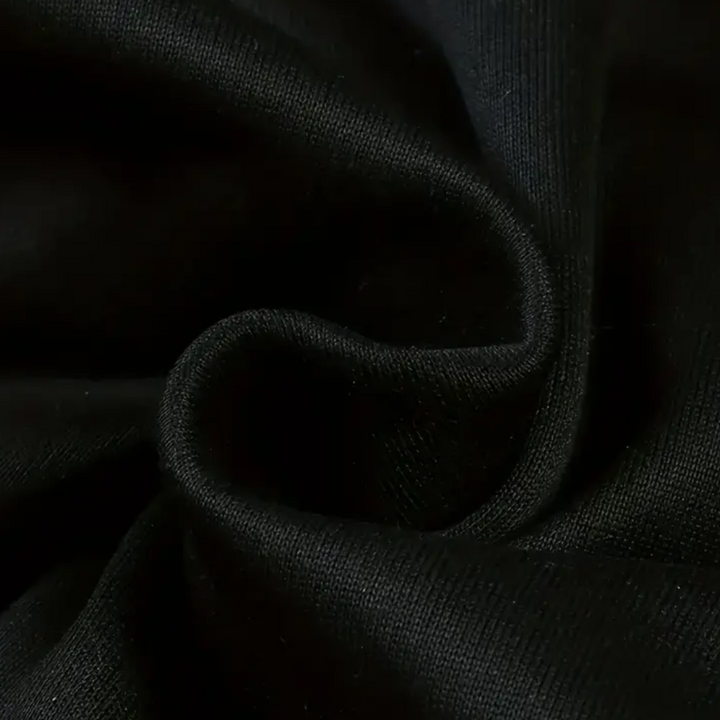 Zwarte katoenen stof close-up, gedetailleerde textuur, hoogwaardige textielmaterialen, geschikt voor kleding en interieurontwerp.