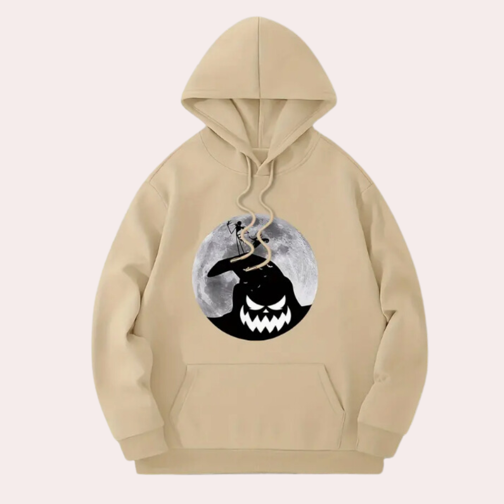 Beige hoodie met Halloween-print, featuring een grijnzende zwarte figuur en volle maan. Comfortabele unisex trui, perfect voor herfstmode.