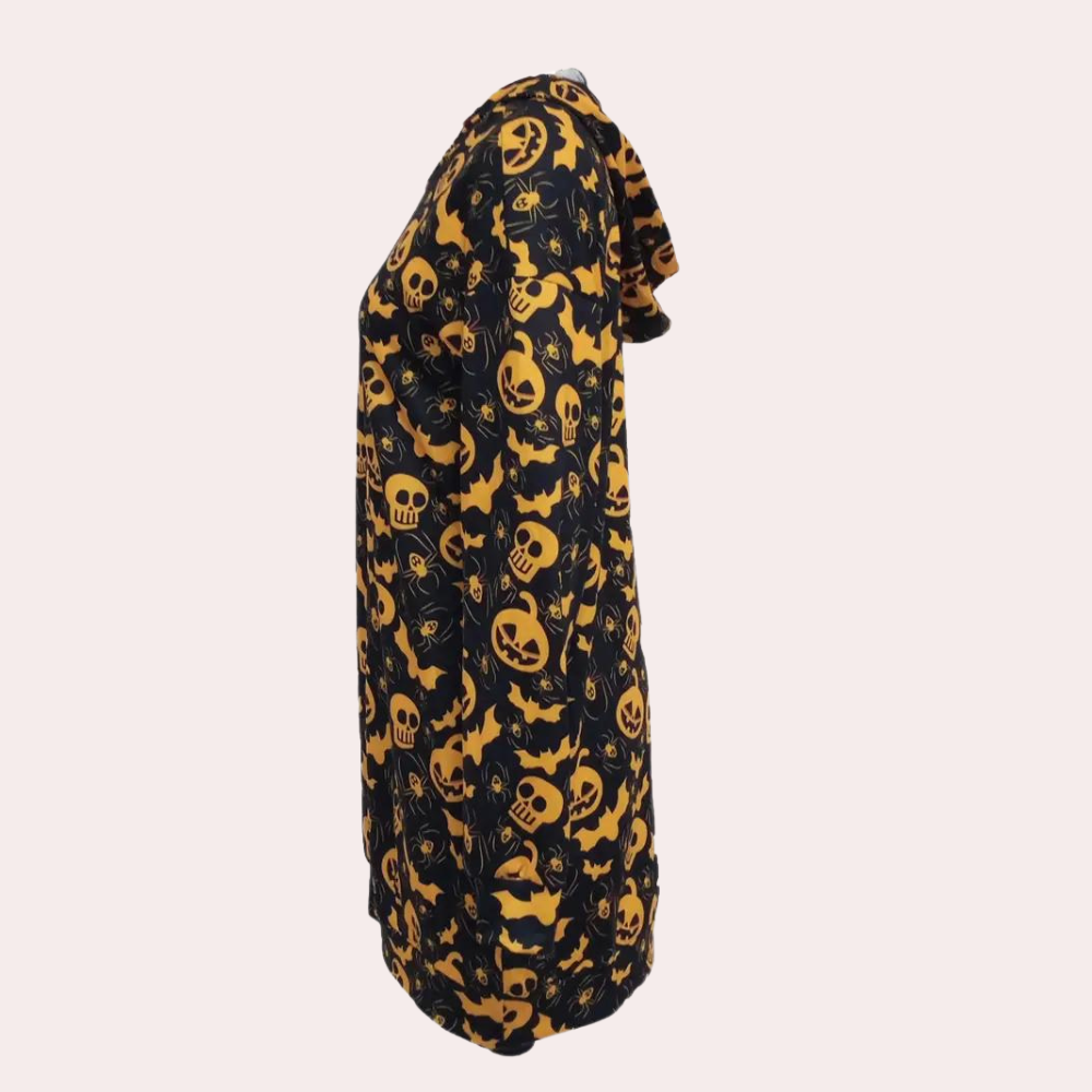 Zwarte Halloween-jurk met oranje schedel- en vleermuisprint, lange mouwen, zijaanzicht. Perfect voor Halloween-feestjes en themakleding.