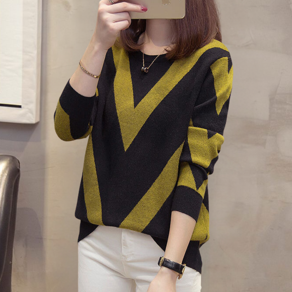 Damestrui met zwart-geel zigzagpatroon, lange mouwen, casual stijl. Perfect voor herfstmode. Comfortabele en trendy dameskleding.