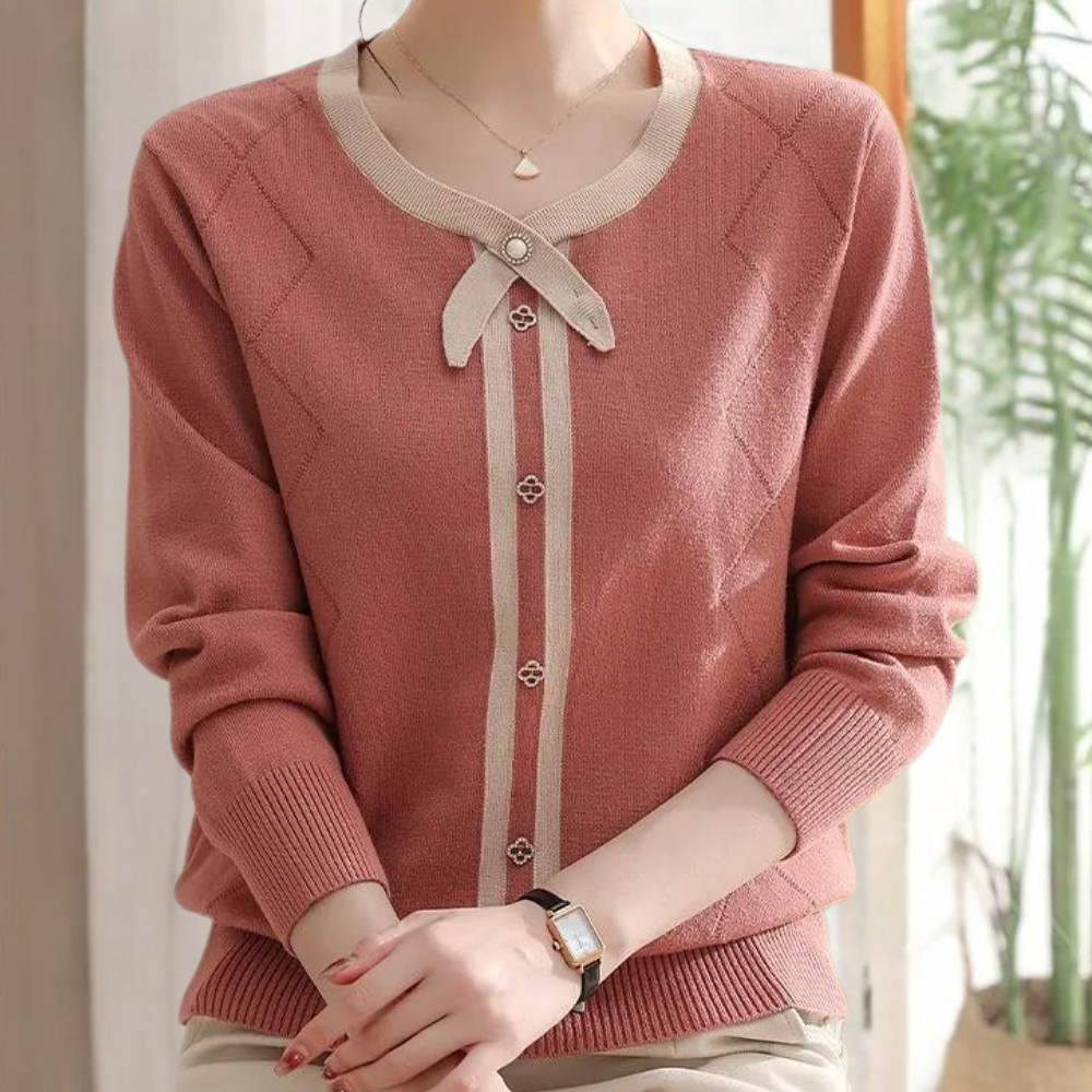 Damestrui met lange mouwen in roze, beige accenten en knoopsluiting. Elegante casual mode, perfect voor herfst- en winterseizoenen.