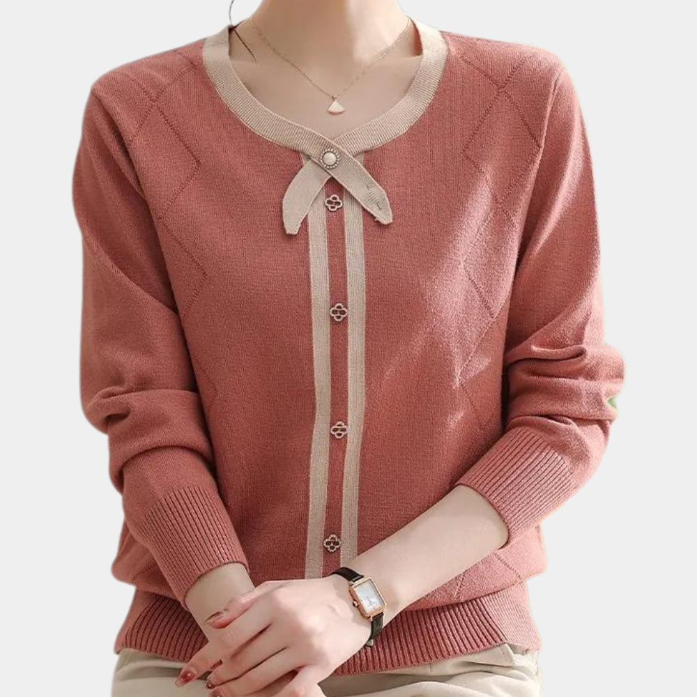 Damestrui in oudroze met beige accenten, ronde hals en knoopsluiting. Elegante gebreide cardigan, perfect voor casual en formele gelegenheden.