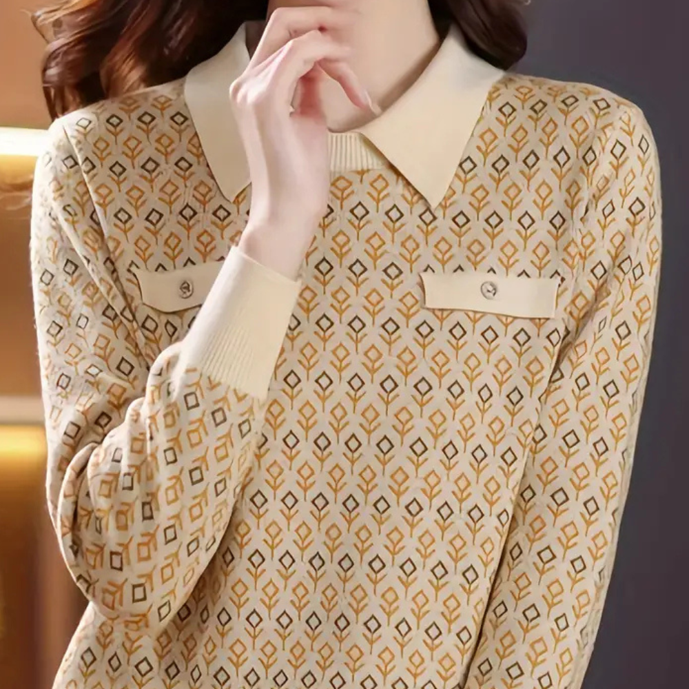 Damestrui met geometrisch patroon, lange mouwen en contrasterende kraag. Modieuze herfstkleding, ideaal voor casual en zakelijke outfits.