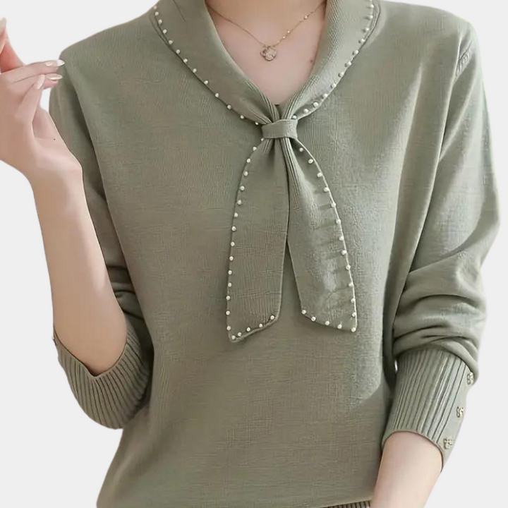 Groene damestrui met lange mouwen, pareldetail en strik, modieuze kleding, herfstmode, comfortabele pasvorm, stijlvolle dameskleding.
