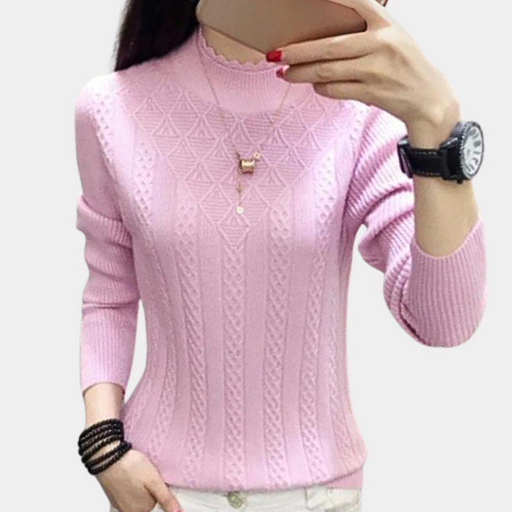 Roze damestrui met kabelpatroon, lange mouwen en ronde hals. Modieuze casual outfit, ideaal voor herfst en winter. Comfortabel en stijlvol design.