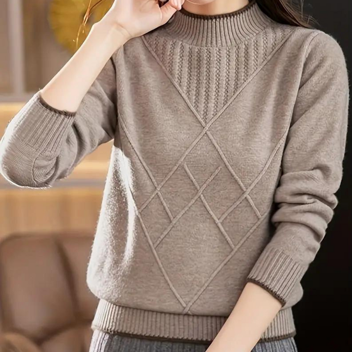 Khaki damestrui met geometrisch patroon, lange mouwen en geribbelde boorden. Perfect voor herfstmode en casual outfits. Comfortabel en stijlvol.
