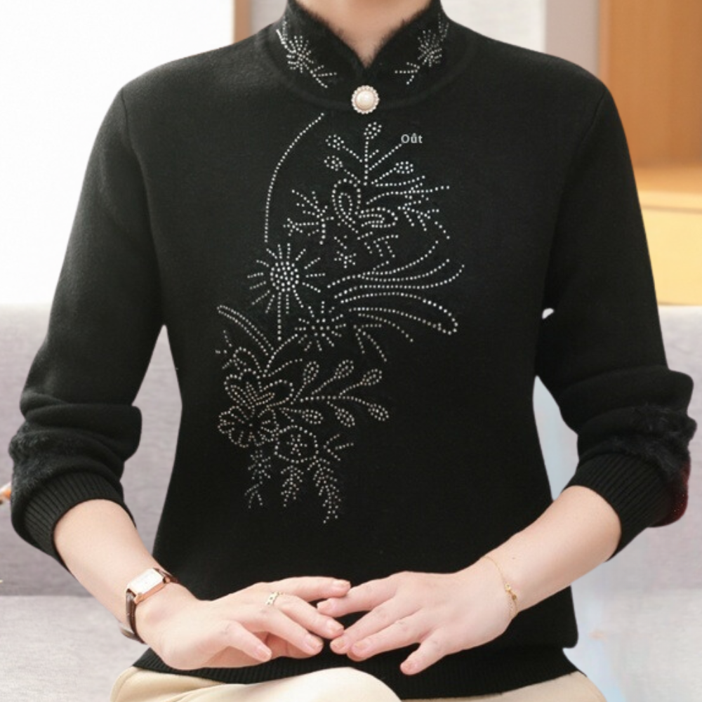 Zwarte damestrui met opstaande kraag, versierd met bloemmotief en strass-steentjes, elegante wintermode, lange mouwen, stijlvolle kleding.