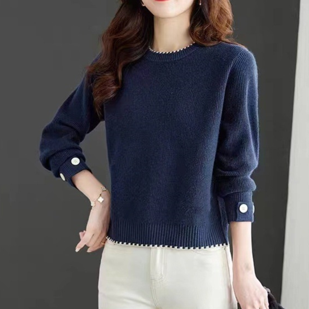 Donkerblauwe damestrui met lange mouwen en knoopdetails, perfect voor herfstmode. Comfortabele pasvorm, ideaal voor casual en stijlvolle outfits.