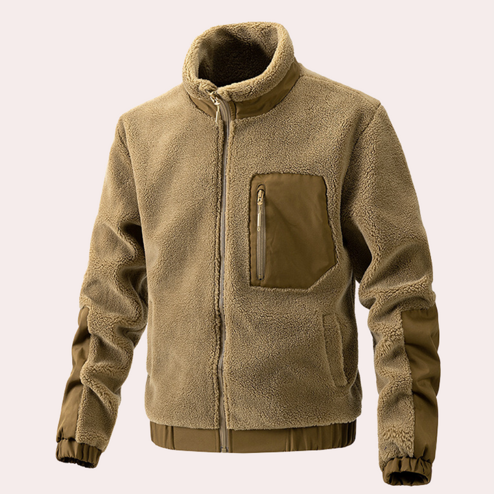 Beige fleece jas met rits, borstzak en elastische manchetten. Warme winterjas voor heren, ideaal voor outdoor activiteiten. Comfortabel en stijlvol ontwerp.