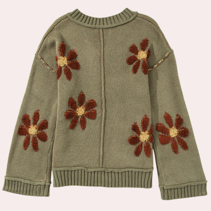 Groene trui met gebreide bloemenpatronen, lange mouwen en geribbelde boorden. Perfect voor herfstmode en casual outfits. Comfortabel en stijlvol design.