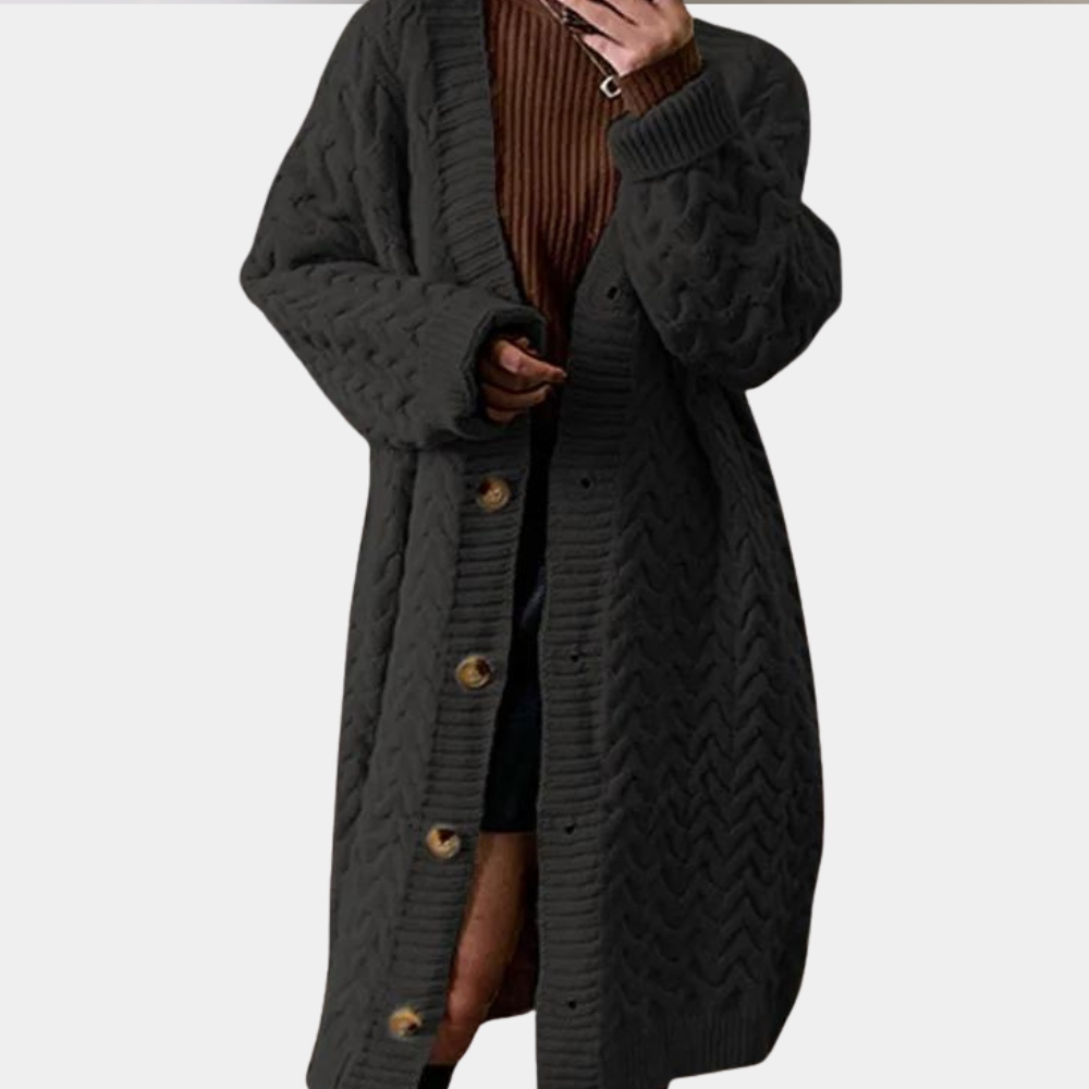 Zwarte gebreide damesvest met knopen, lange mouwen en kabelpatroon. Perfect voor herfst- en wintermode. Comfortabel en stijlvol kledingstuk.