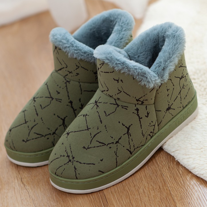 Groene winterlaarzen met bontvoering, antislipzool en abstract patroon. Warme dameslaarzen voor koude seizoenen. Comfortabele en stijlvolle schoenen.