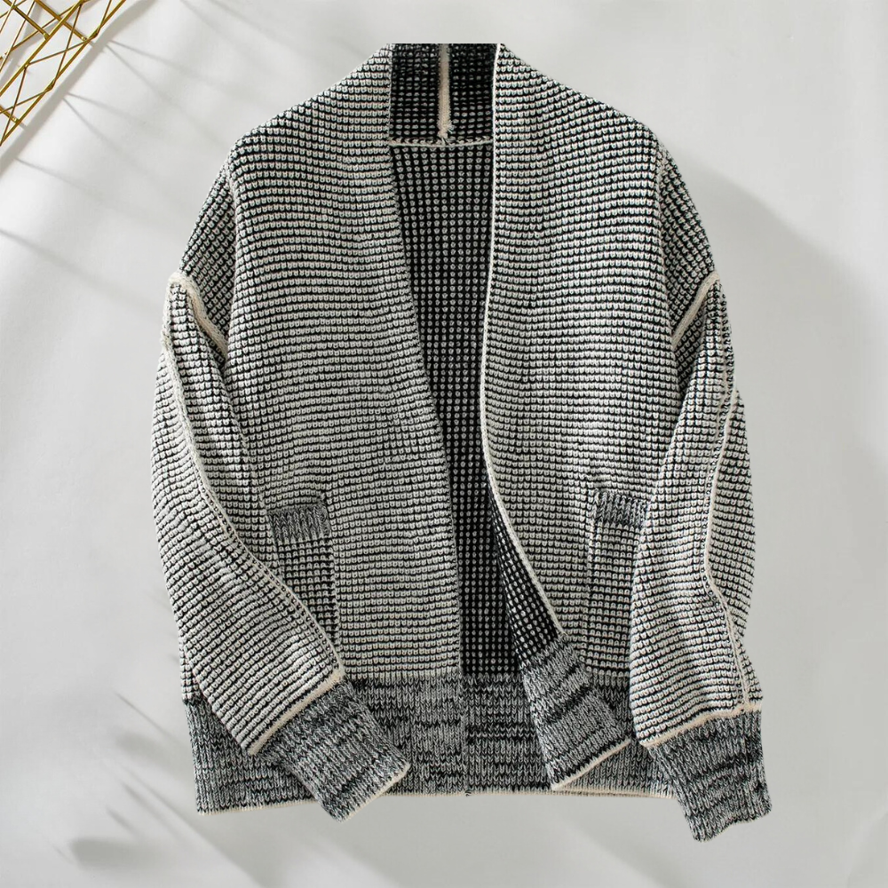 Grijze gebreide cardigan met open voorkant, textuurpatroon en lange mouwen. Perfect voor herfstmode en casual outfits. Unisex kledingstijl.