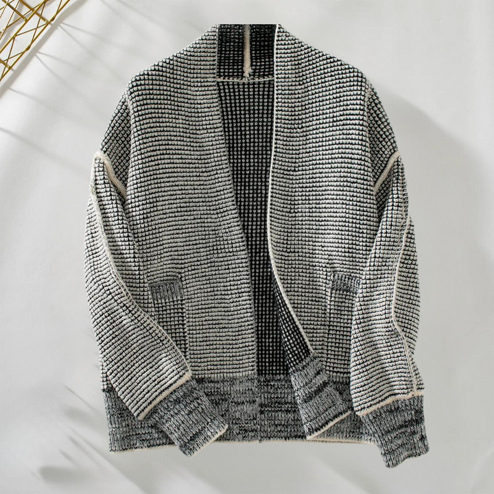 Grijze gebreide cardigan met open voorkant, textuurpatroon en lange mouwen. Perfect voor herfstmode en casual outfits. Unisex kledingstijl.