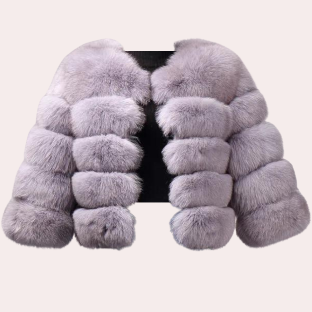 Luxe grijze bontjas voor dames, pluizig en stijlvol, ideaal voor wintermode. Hoogwaardige kwaliteit, trendy en warm. Perfect voor chique gelegenheden.