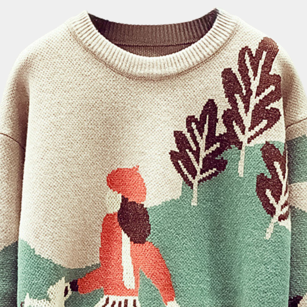 Beige trui met kleurrijk gebreid landschap, vrouw in rode outfit, groene bomen. Unieke herfstmode, warme gebreide kleding, stijlvol design.
