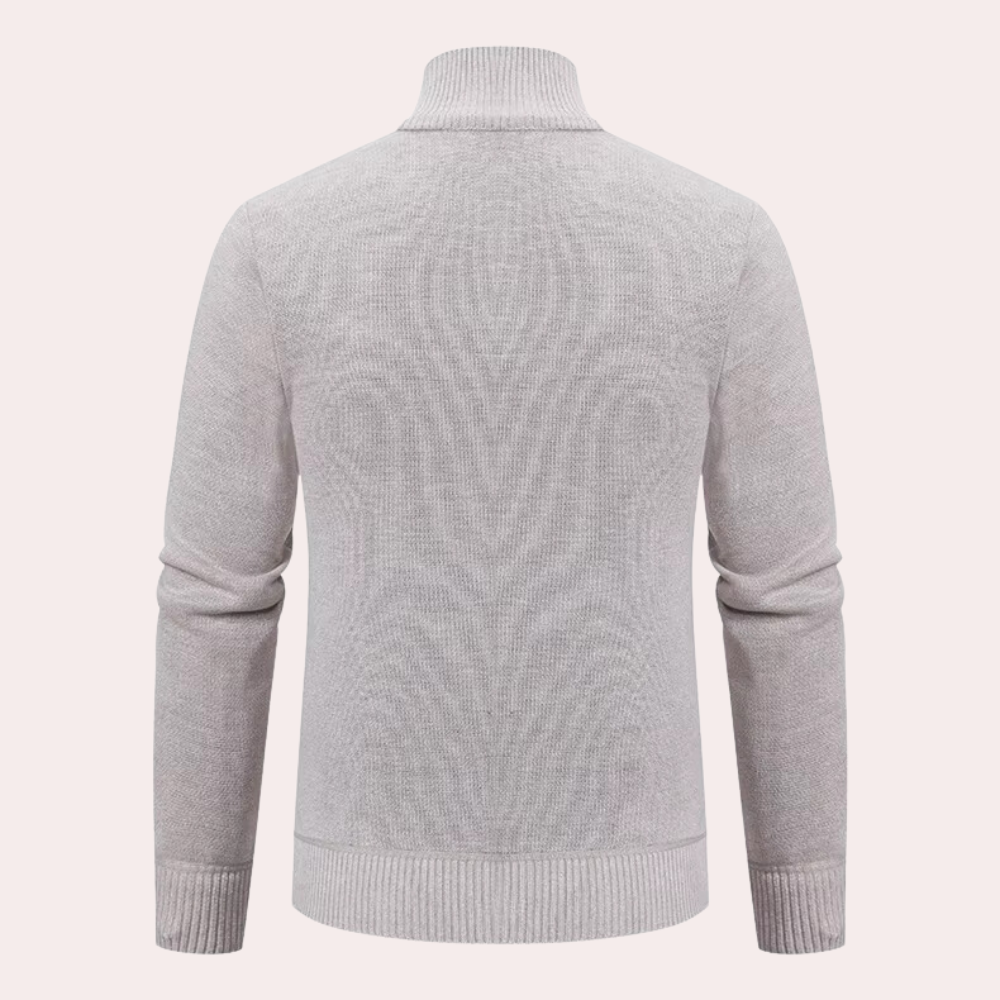 Grijze wollen trui met hoge kraag, lange mouwen en geribbelde boorden, perfect voor herenmode en winterkleding. Comfortabel en stijlvol ontwerp.