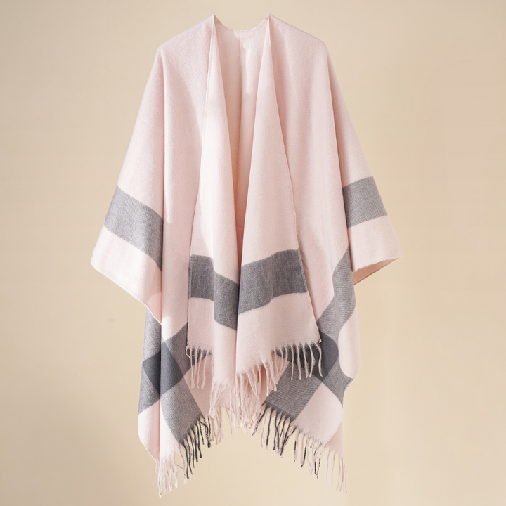 Roze en grijze wollen poncho met franjes, stijlvolle damesmode, warme winterkleding, elegante sjaal, comfortabele en modieuze accessoire.