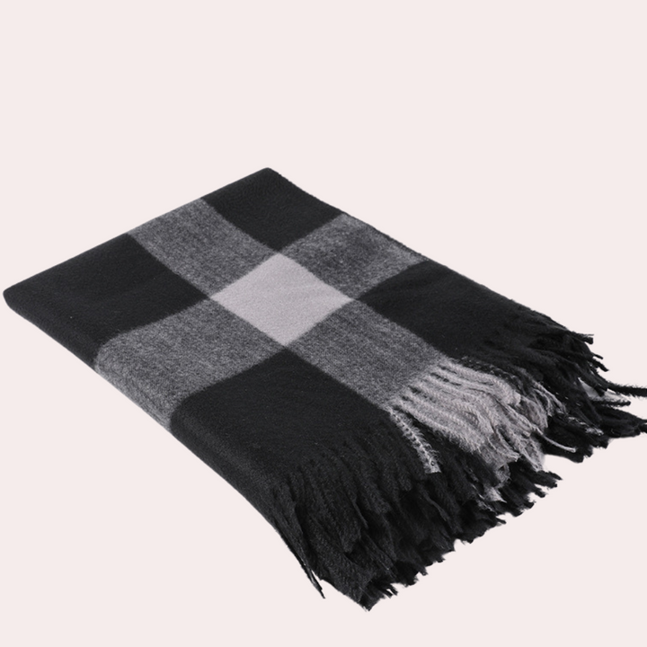 Zwart-grijs geruite wollen deken met franjes, luxe plaid voor woonkamer, warme en stijlvolle woonaccessoire, perfect voor winterse avonden.