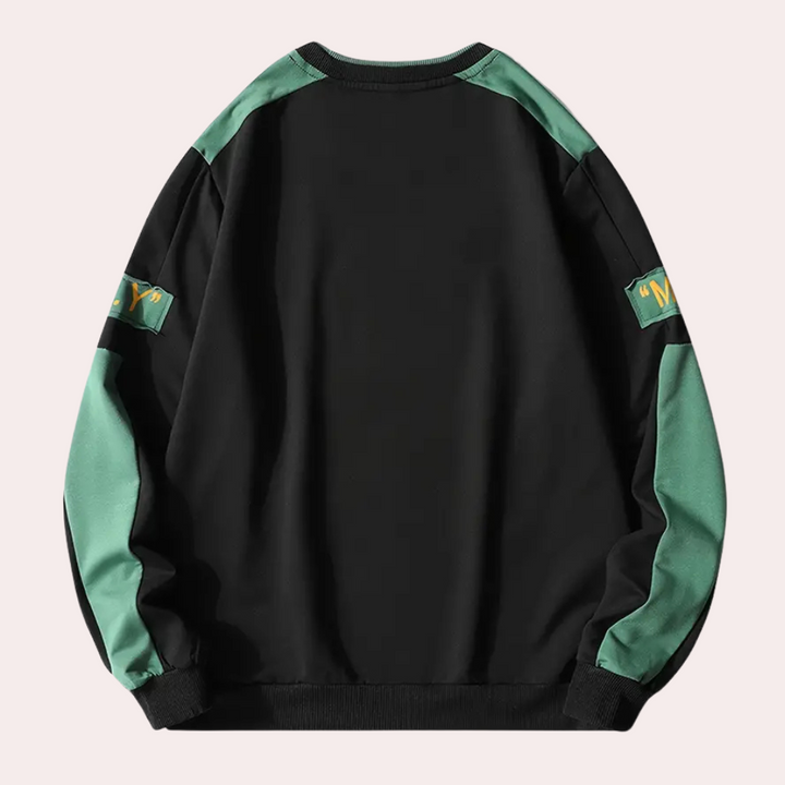 Zwarte en groene unisex sweatshirt met lange mouwen, contrasterende schouderpanelen en opdruk op de mouwen. Comfortabele streetwear stijl.