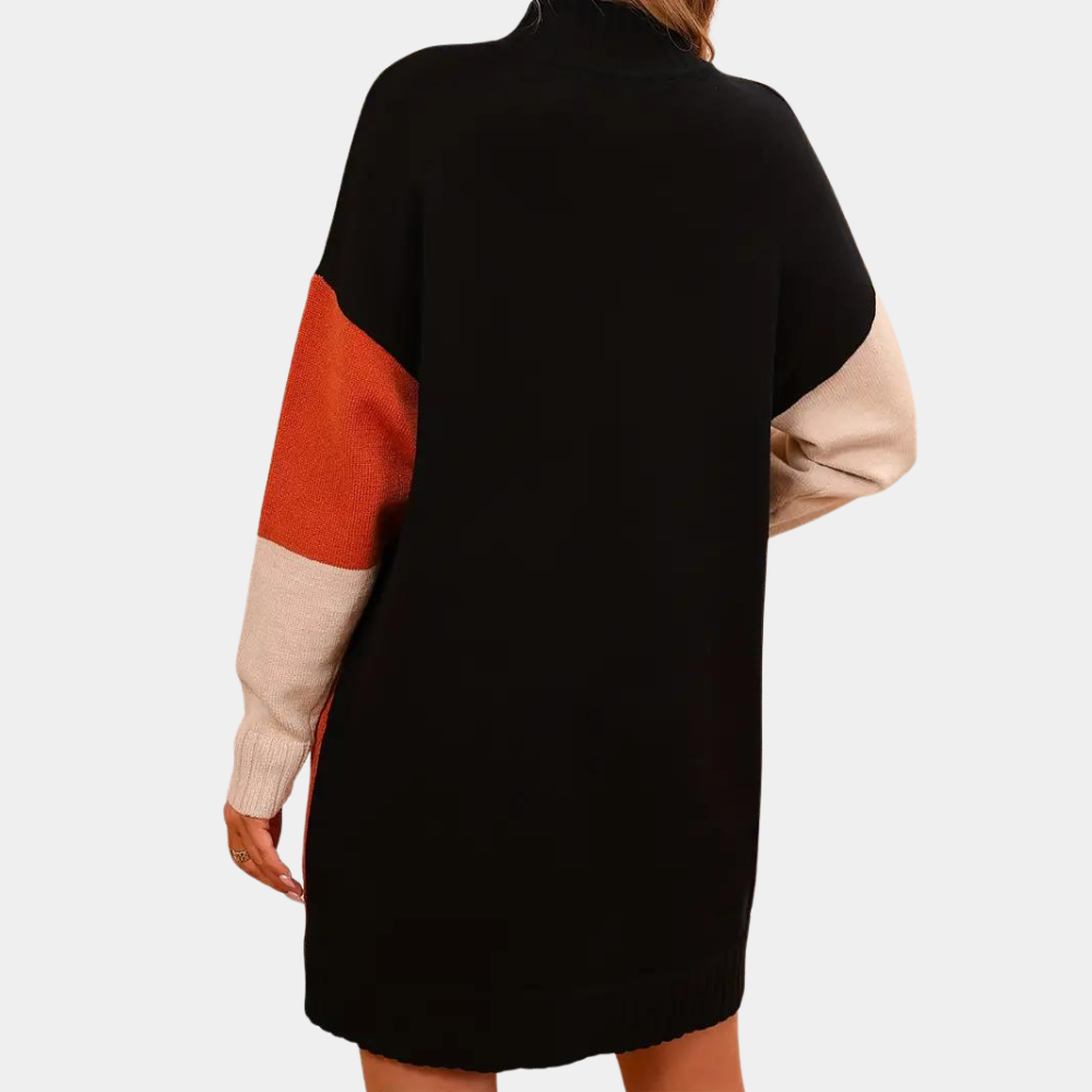 Zwarte oversized trui jurk met lange mouwen, kleurblokken in oranje en beige, damesmode, herfst-winter kleding, comfortabele casual stijl.