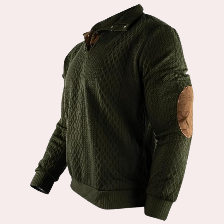 Donkergroene herensweater met ruitpatroon, bruine elleboogstukken en opstaande kraag. Comfortabele trui voor heren, ideaal voor casual en stijlvolle looks.