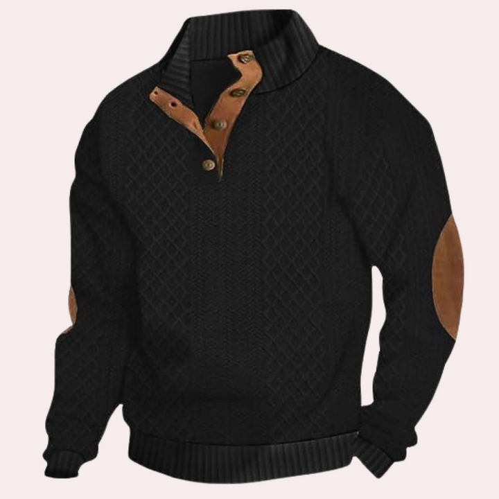 Zwarte herensweater met bruine knopen en elleboogstukken, comfortabele pasvorm, gebreid patroon, ideaal voor casual en stijlvolle herenkleding.