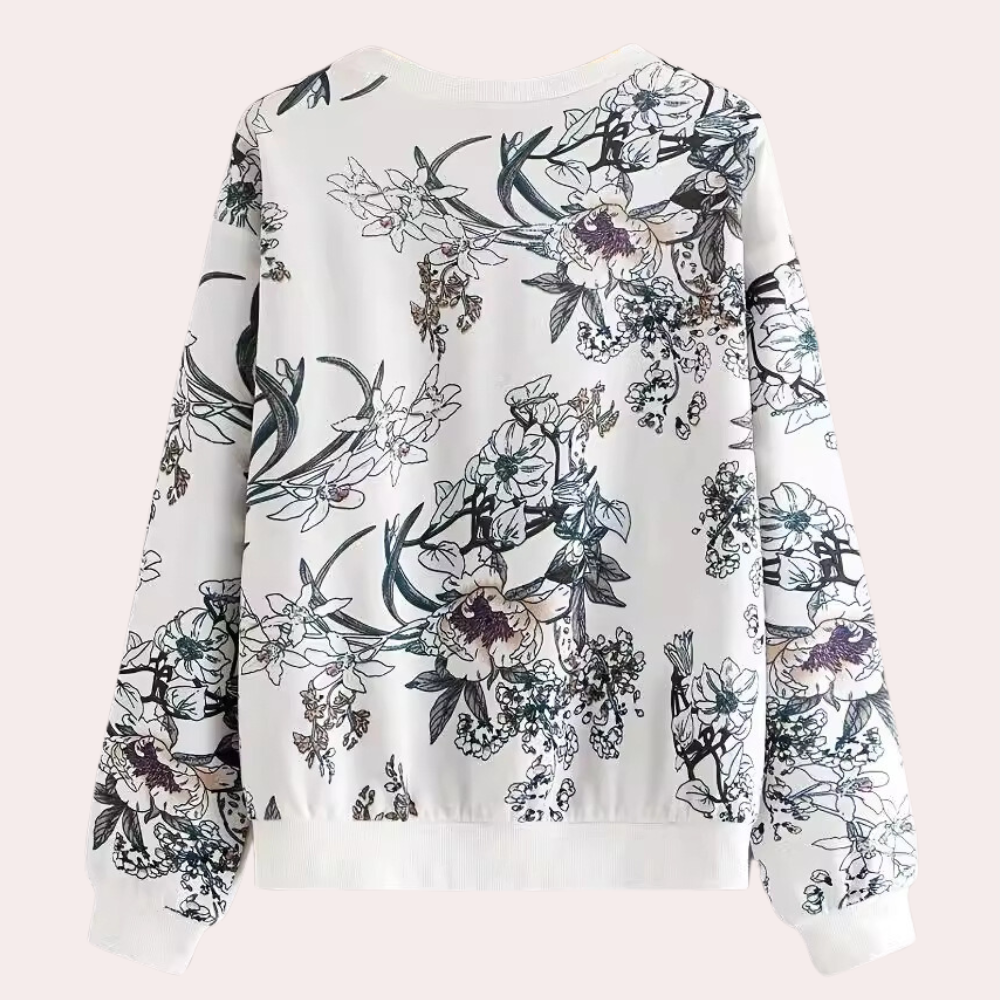 Witte damestrui met bloemenprint, lange mouwen en ronde hals. Modieuze casual kleding, ideaal voor lente en herfst. Comfortabele pasvorm.