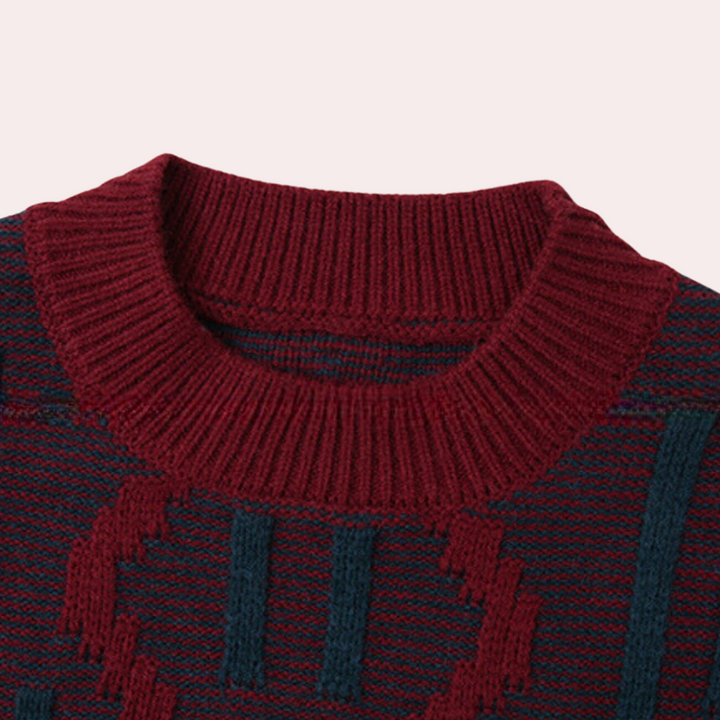 Bordeauxrode trui met ronde hals en geometrisch patroon, gebreid van wol. Perfect voor herfstmode en winterkleding. Stijlvol en warm.