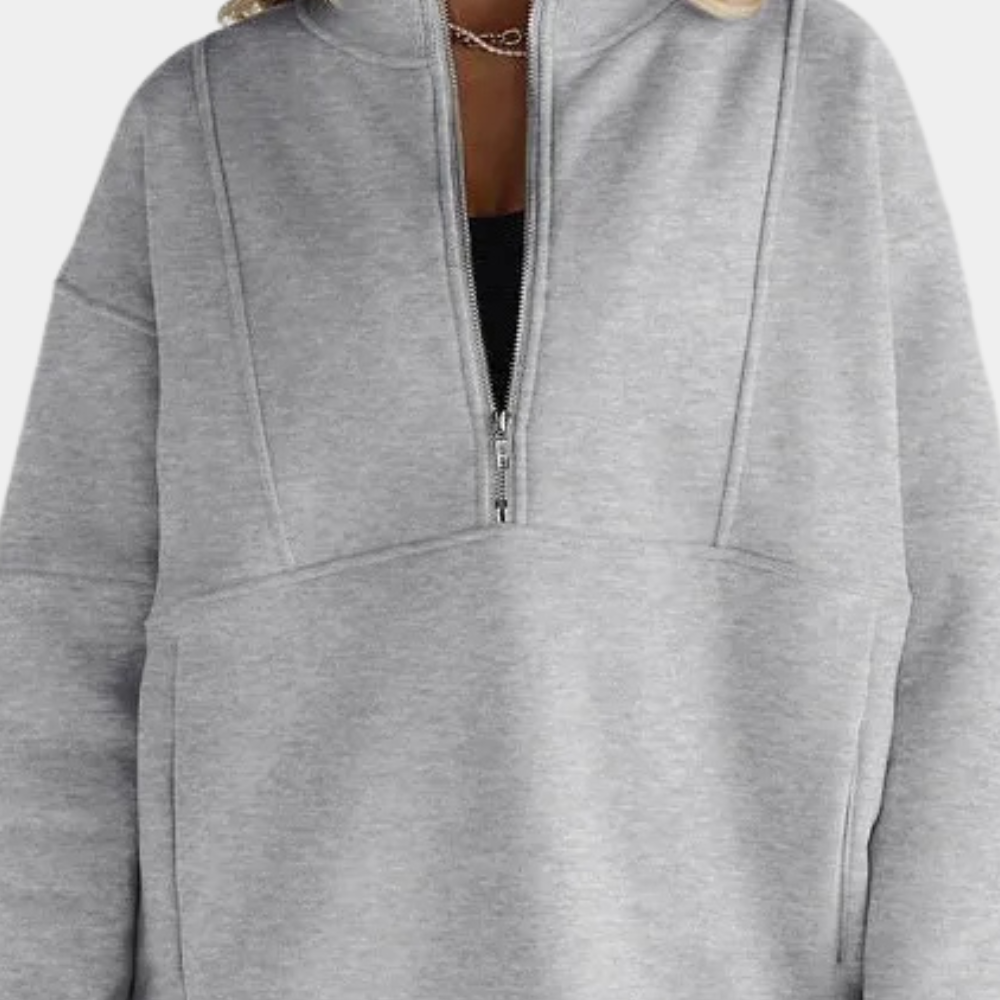 Grijze damestrui met halve rits, comfortabele pasvorm, casual mode, ideaal voor herfst en winter, trendy kleding, zachte stof.