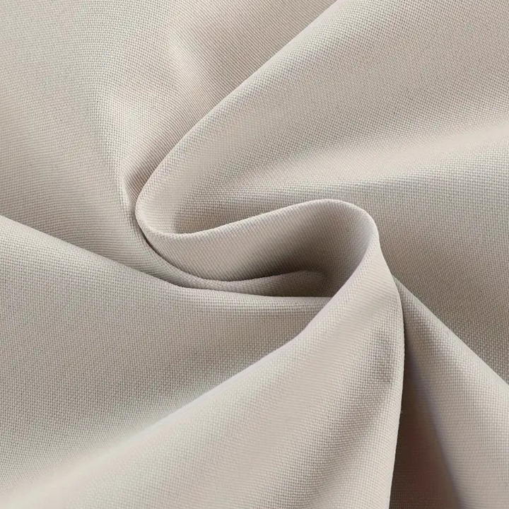 Beige stof close-up, geweven textuur, ideaal voor kleding en interieur, hoogwaardige textielmaterialen, duurzaam en stijlvol design.