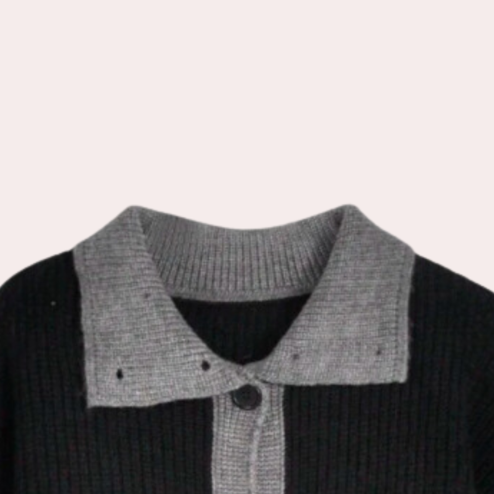 Zwart-grijs gebreid vest met contrasterende kraag en knoopsluiting, stijlvolle damesmode, herfst-winter kleding, trendy en comfortabel.
