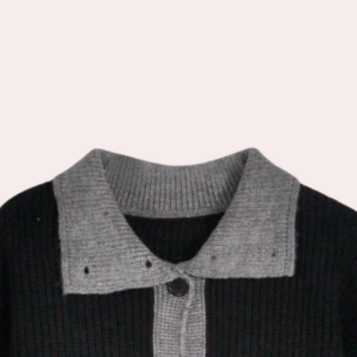Zwart-grijs gebreid vest met contrasterende kraag en knoopsluiting, stijlvolle damesmode, herfst-winter kleding, trendy en comfortabel.