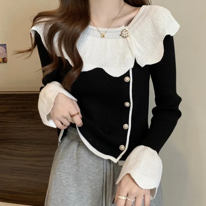 Zwart-witte damestrui met knoopsluiting en ruches, elegante stijl, lange mouwen, geschikt voor herfstmode, trendy en comfortabel design.