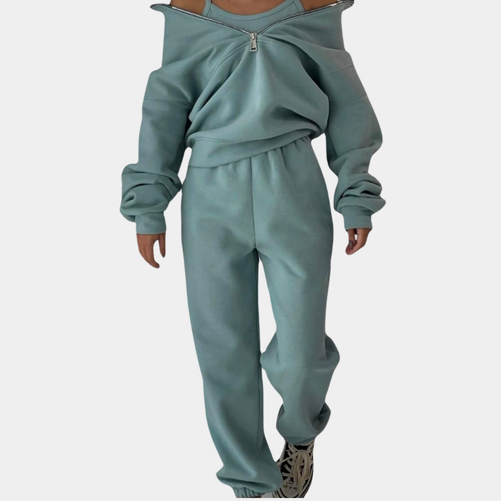 Groen tweedelig joggingpak voor dames, bestaande uit een joggingbroek en een vest met halve rits