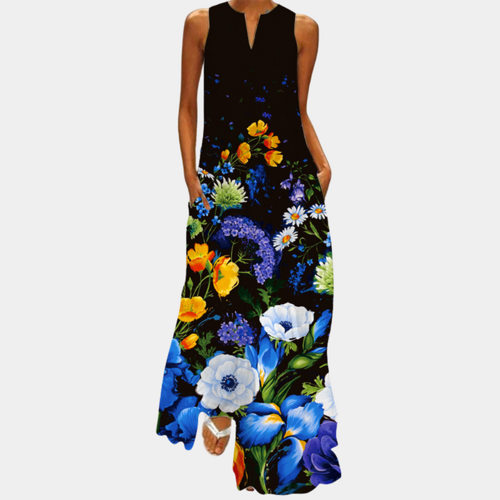 Kleurrijke damesjurk met bloemenprint, mouwloos ontwerp, lange maxi-stijl. Perfect voor zomerse gelegenheden en casual mode.