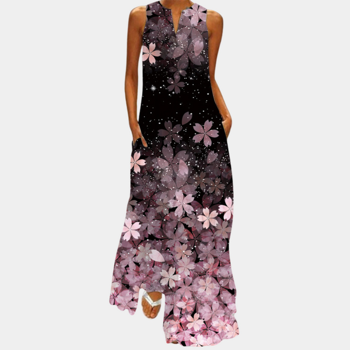 Kleurrijke damesjurk met bloemenprint, mouwloos en lange lengte. Perfect voor zomerse gelegenheden. Trendy en stijlvol design.