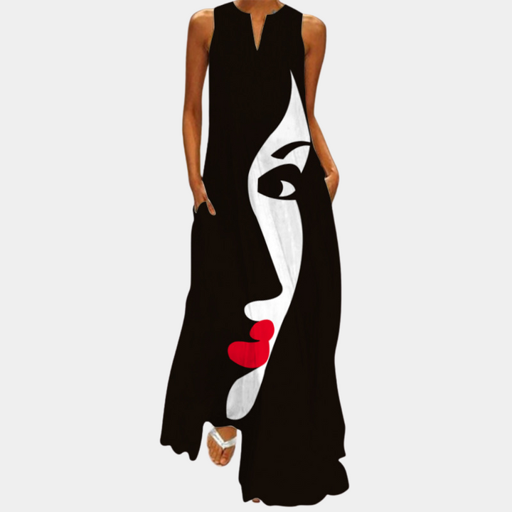 Zwarte damesjurk met abstract gezicht, rode lippenprint, mouwloos, lange maxi-stijl. Perfect voor zomer, casual en feestelijke gelegenheden.