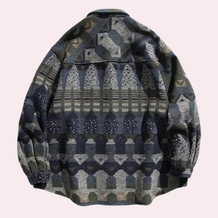 Vintage geïnspireerd oversized jasje met geometrisch patroon in aardetinten. Perfect voor herfstmode, unisex stijl, comfortabele pasvorm.