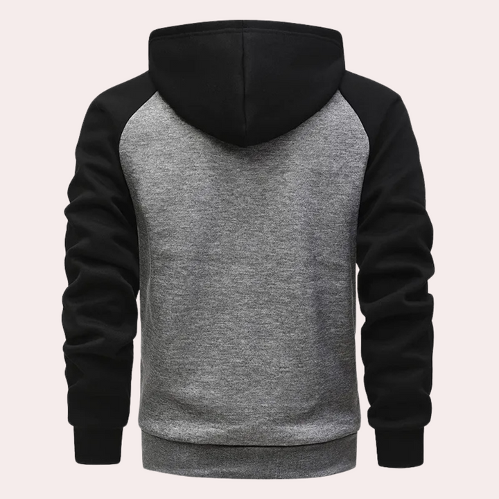 Grijze en zwarte hoodie met capuchon, raglanmouwen en zachte stof. Perfect voor casual en sportieve outfits. Unisex sweatshirt voor dagelijks gebruik.